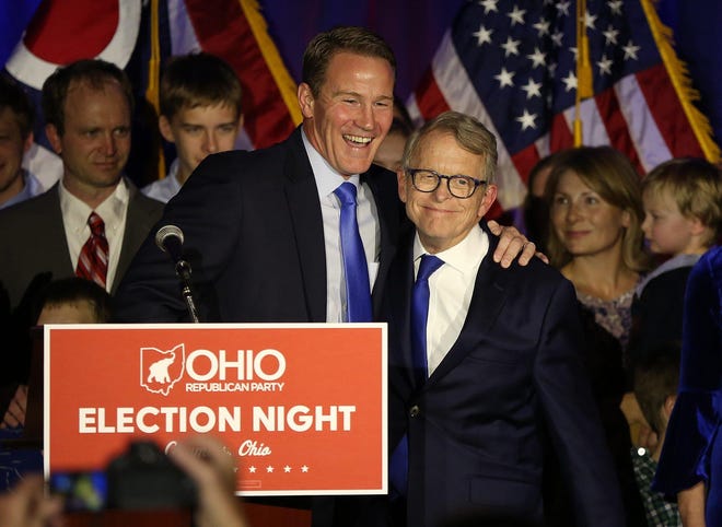 Jon Husted (left) and Mike DeWine celebrate the win for their Republican gubernatorial ticket at the GOP celebration in 2018. They are running for reelection in 2022.