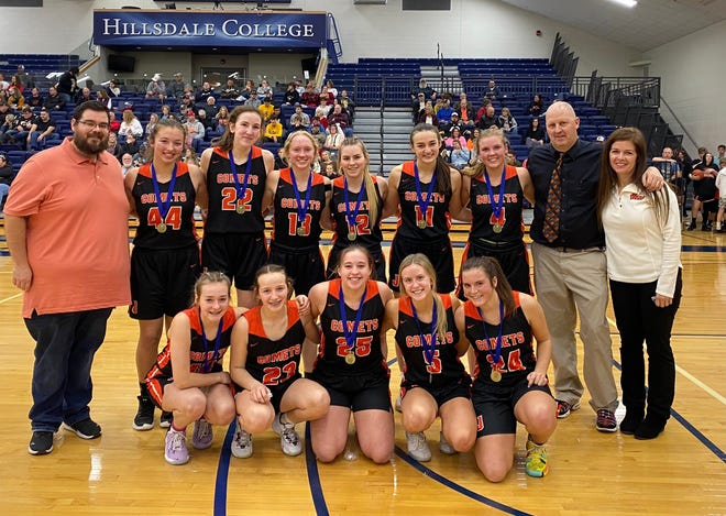 The Jonesville girls basketball team with their coaching staff led by head coach Tom Dunn.