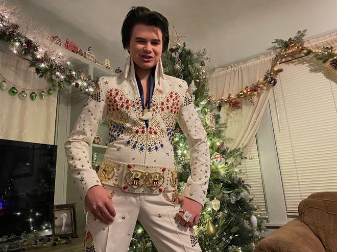 13-year-old Bryson Vines shows off one of the Elvis Presley costumes he wears when he performs as a tribute artist at his family's Howell home, Tuesday, Dec. 14, 2021.