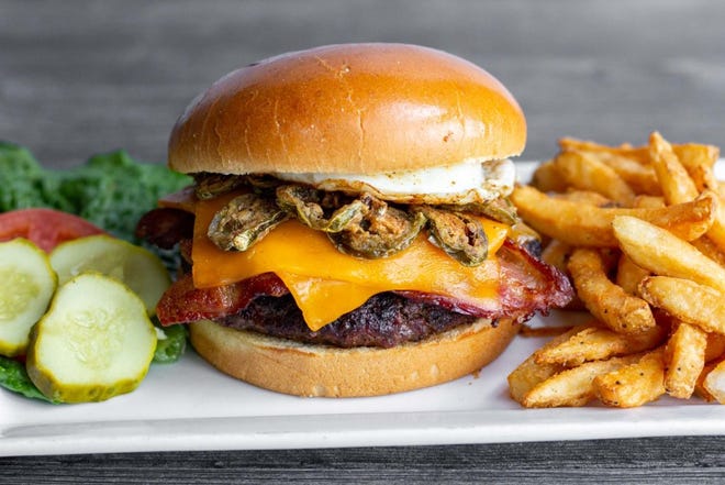 Rise & Shine, MacKenzie River Pizza, Grill & Pub's entry for the 2022 Downtown Burger Battle. Brown sugar bacon and a fried egg top this burger.