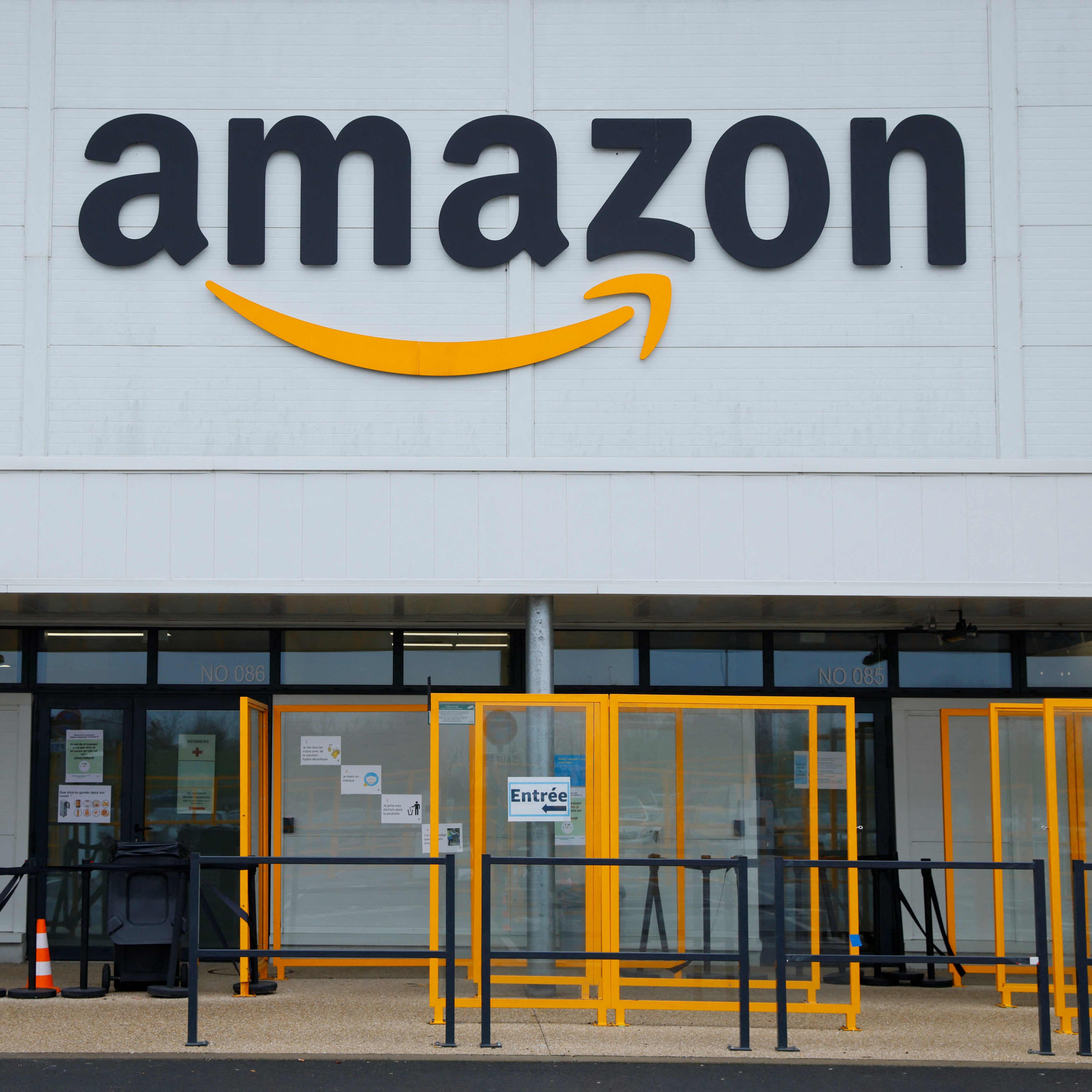 A picture shows the Amazon logo on the frontage of an Amazon's centre in Bretigny-sur-Orge, on December 14, 2021.