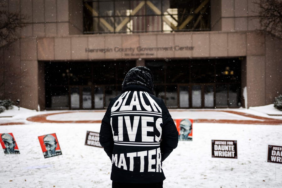 A person demonstrates Dec. 21 outside the Hennepin County Government Center in Minneapolis during jury deliberations in the trial of former police officer Kim Potter.