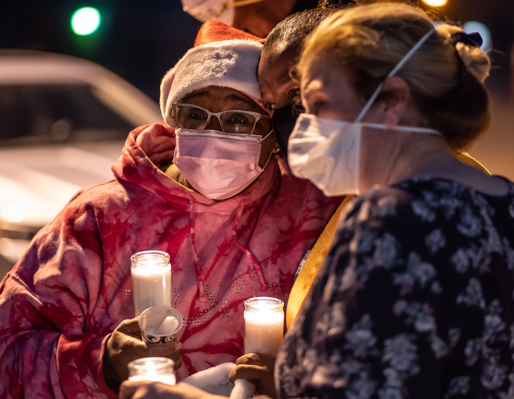 McLaren Flint staff, family and friends gather during a candlelight memorial for Santa Staples, an RN at McLaren Flint who died from COVID-19, in November 2020.