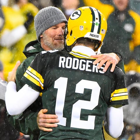 Brett Favre and Aaron Rodgers at halftime of a 201