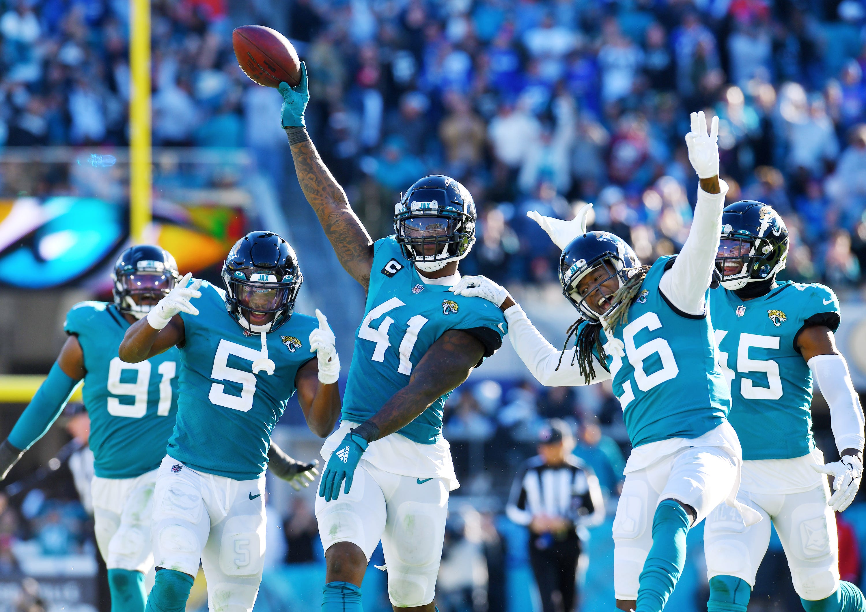 Jaguar Josh Allen and teammates celebrate a turnover. 