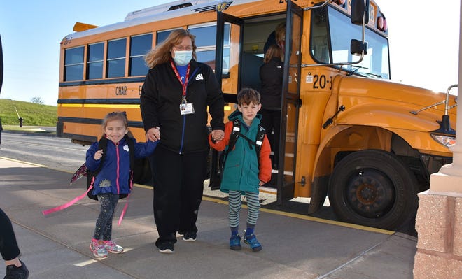 Students arrive at Taylor School from a mid-morning Char-Em ISD bus route.