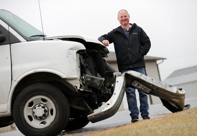 Dan Theimer, owner of Gracy's Auto Body, spent three hours delivering 40 packages after a delivery van full of FedEx packages was towed to his business. Theimer is pictured in front of his business Dec. 23 in Little Chute. "It was a small thing to do for me, but it seemed like a big thing to them," he said.