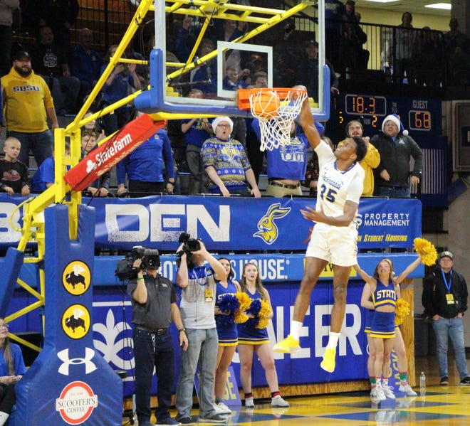 Doug Wilson throws down a dunk near the end of SDSU's 82-76 win over Oral Roberts on Wednesday night at Frost Arena.
