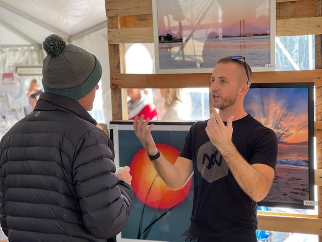 Photographer Elliot MacGuire shares his work at the Developing Artist Collaboration's Sip and Shop event over Black Friday weekend in 2021.