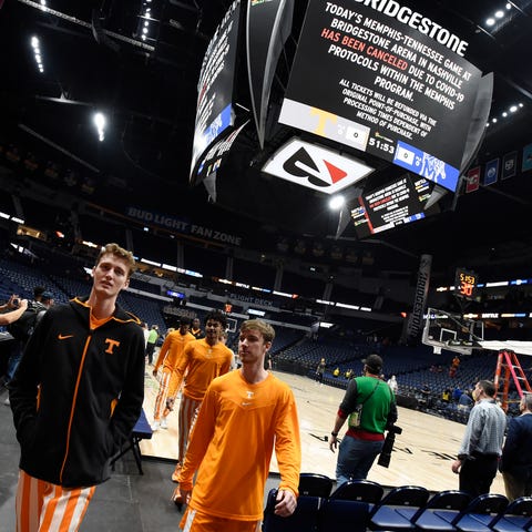 Tennessee players walk off the court after their g