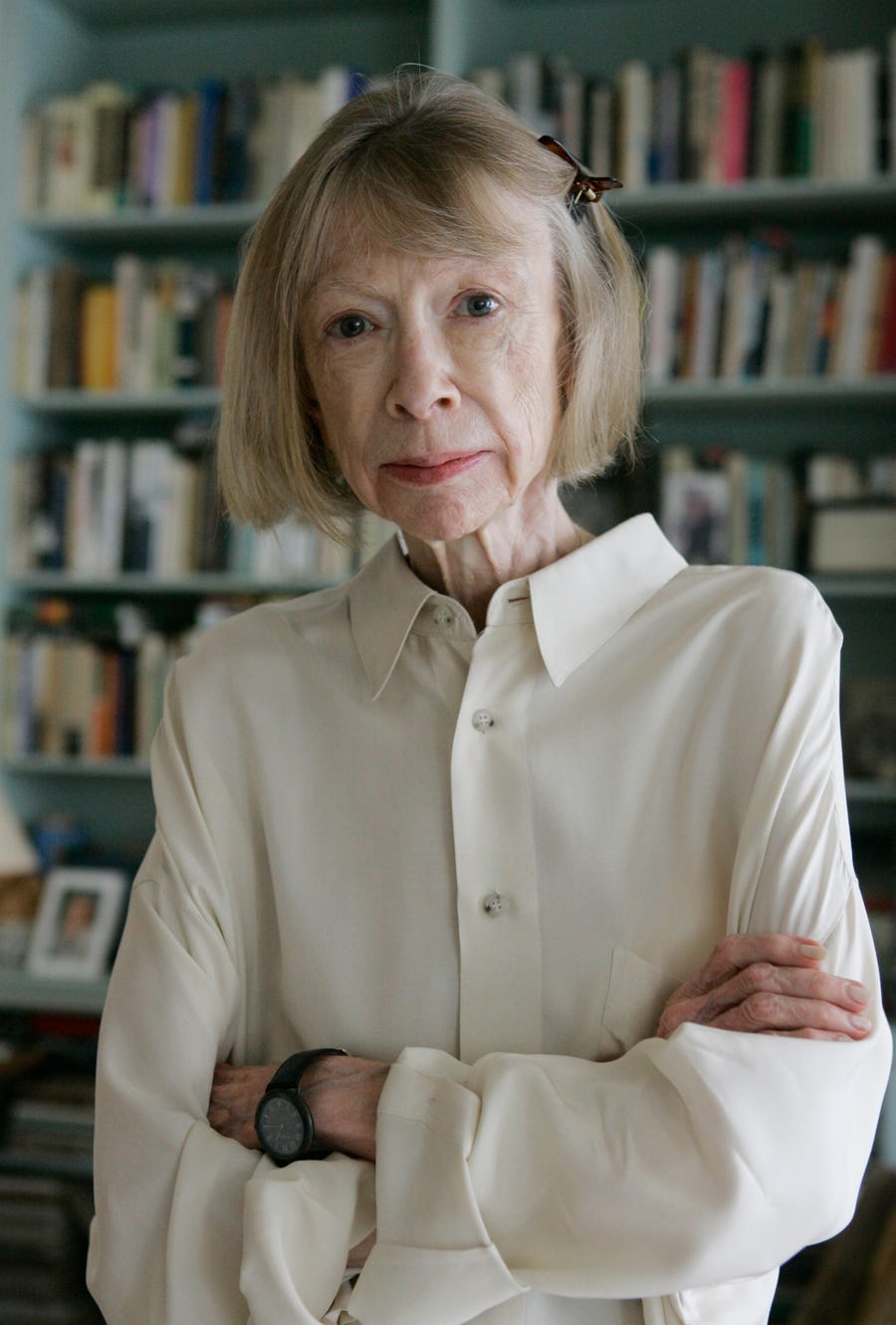 Author Joan Didion poses for a portrait, Monday, Sept. 26, 2005, in her New York apartment. Didion, the revered author and essayist whose provocative social commentary and detached, methodical literary voice made her a uniquely clear-eyed critic of a uniquely turbulent time, has died. She was 87.