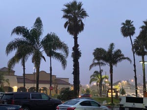 Gloomy skies and parking lot puddles greeted shoppers at an Oxnard shopping center on Ventura Boulevard Thursday evening as a rain storm doused the area.