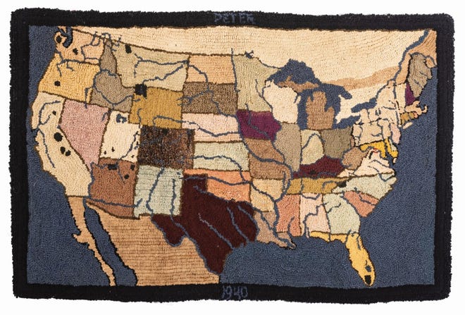 This hooked rug with a picture of the continental United States has the name of the recipient and the date on the back. It brought $469 at Cowan's Auctions.
