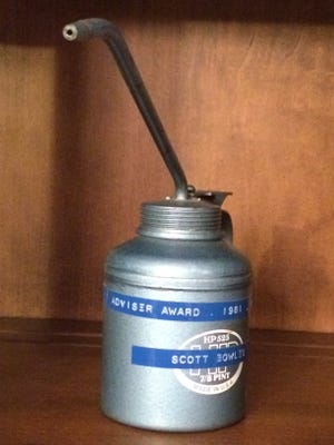 Bob Button, a journalism teacher at Grosse Pointe South High School, gave "oil can" awards to students most valued by their newspaper adviser for creating a smooth operation. This one belongs to Scott Bowles, a former reporter for The Detroit News, The Washington Post and USA Today who keeps it on his desk at home in LA.