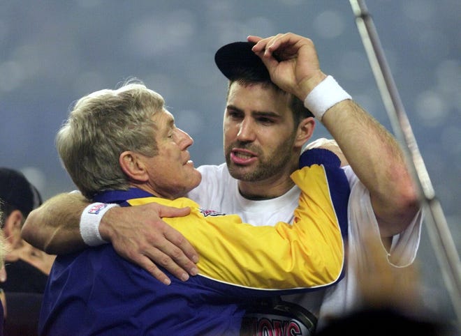 Real Rams quarterback Kurt Warner hugs head coach Dick Vermeil following their Super Bowl victory.