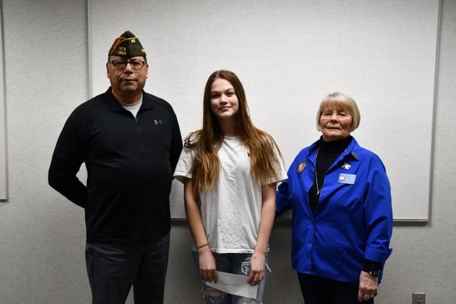 VFW Post 1902 Gambling Manager Gerry Moreno, left, and VFW Auxiliary President and Scholarship Chair Pam Delage, right, are pictured with this year's Patriot's Pen essay winner Rhianna Moore.