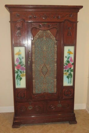 This armoire is in the Art Nouveau style that had its beginning in Paris, France.