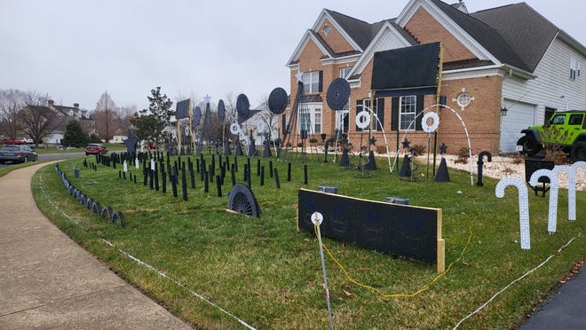 Manny Duarte, of Middletown, shows off his front yard during the day time without his 24,000 LED lights in action.