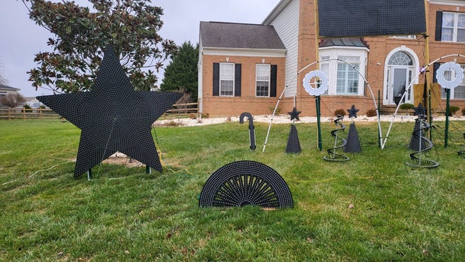 It might not look like it, but the star (on the right) is 7-feet-tall and boasts 24,000 LED lights in the front yard of Manny Duarte's house in Middletown.