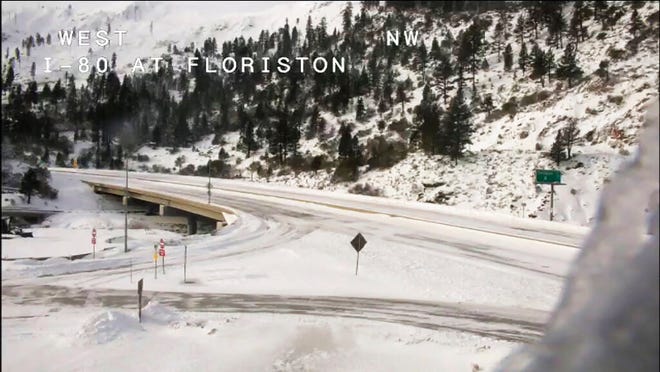 This image from video provided by Caltrans District 3 shows a closed westbound I-80 on Sunday, Dec. 26, 2021. The road from Colfax, California, to the Nevada state line was closed due to heavy snowfall.