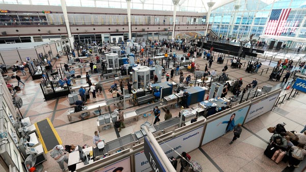 Travelers queue up at the south security checkpoin