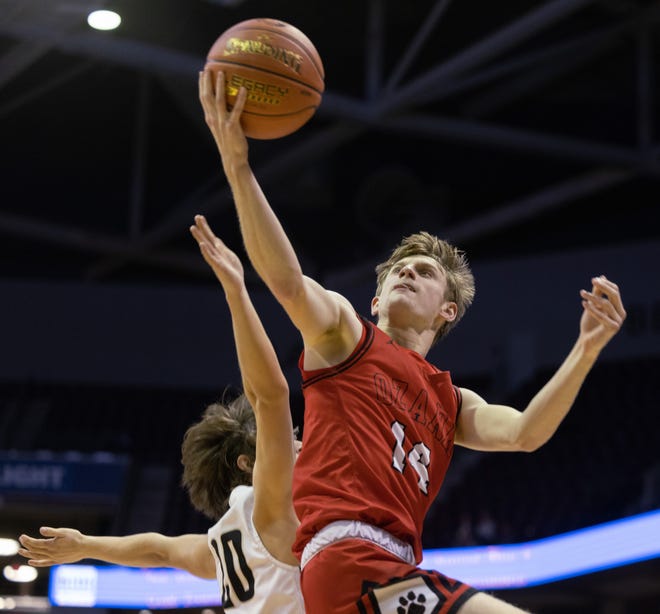 Ethan Whatley, from Ozark, puts a shot over a Lebanese defender during the opening round of the gold bracket in the Blue and Gold tournament on December 27, 2021. Jesse Scheve / Special to News-Leader