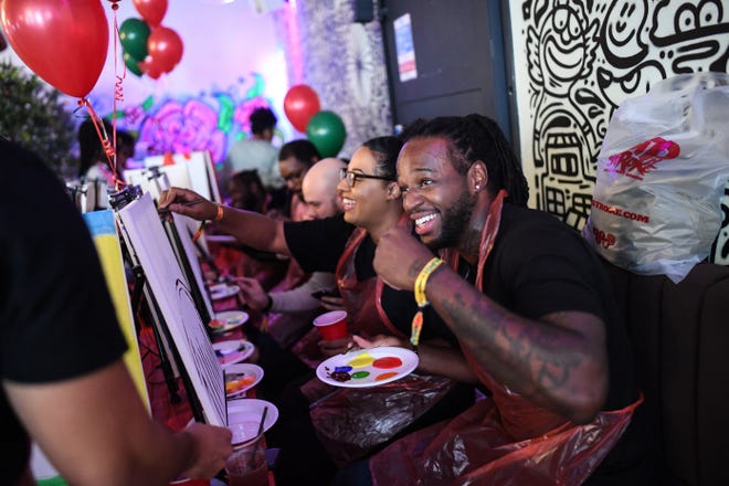 Patrons will ring in 2022 early while painting and drinking a tasty beverage during Painting with a Twist in Newark on Friday. Pictured are customers at a 'Sip n Stroke' painting and drinking event on Sept. 12, 2020 in England.