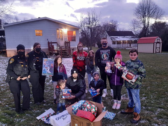Yates County sheriff's deputies, along with Friendly Motors staff, spent the afternoon of Dec. 22 delivering toys to 36 children within Yates County.