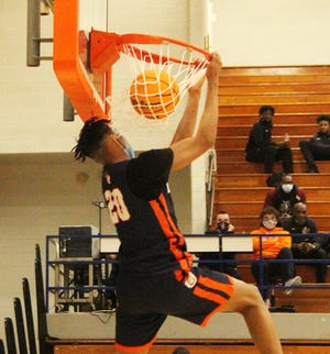 Justin Mullins of Oak Park-River Forest dunks during Tuesday's first-round matchup with Warren Twp.