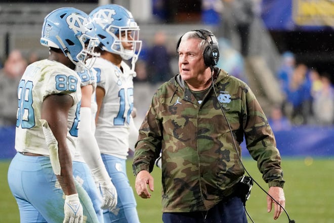 North Carolina coach Mack Brown, shown here in last month’s overtime loss at Pittsburgh, said his team is through with COVID-19 testing requirements ahead of the Duke’s Mayo Bowl game.