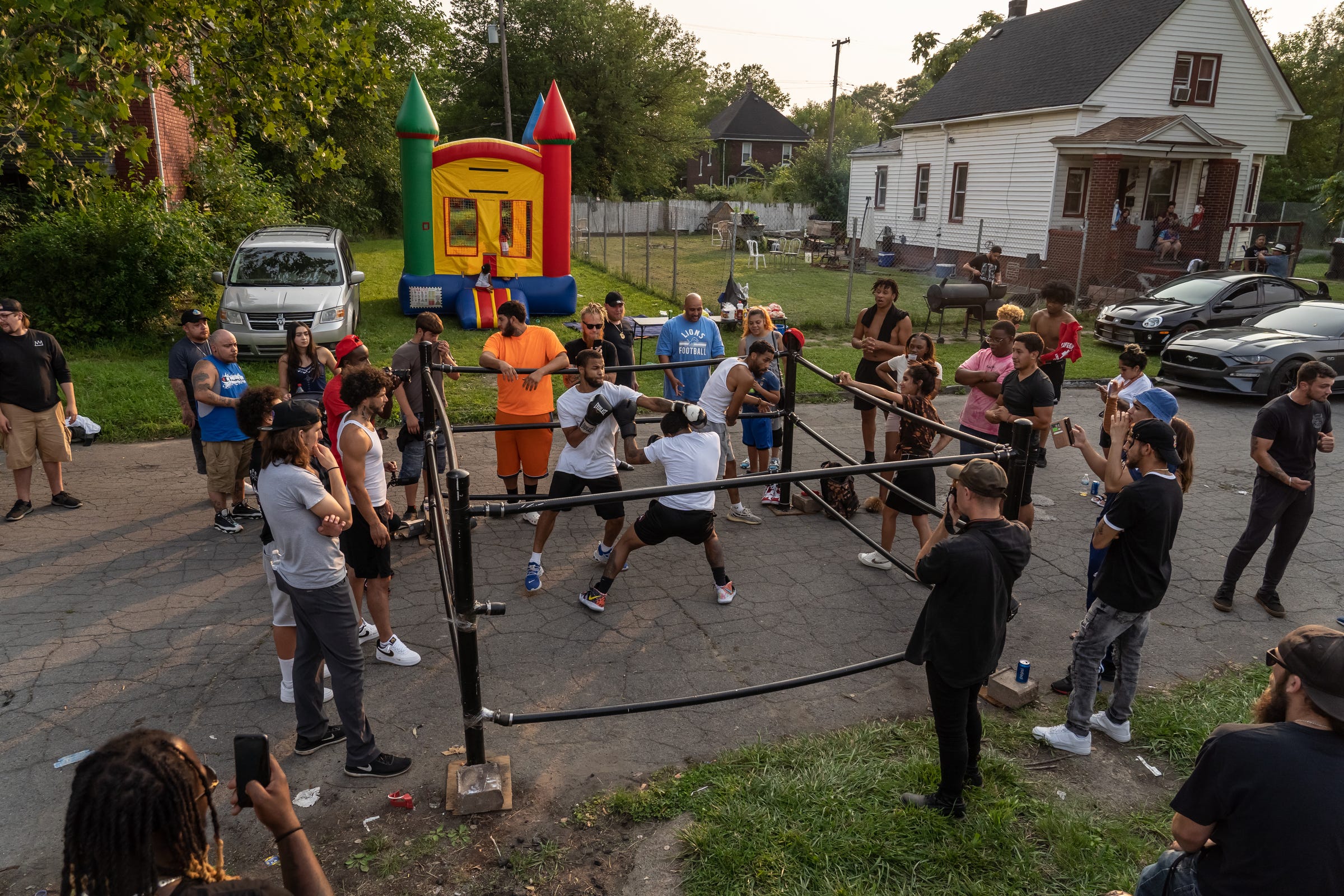 People take part in a boxing match during a Pick Your Poison Detroit event in Detroit's Delray neighborhood on Sunday, July 18, 2021.