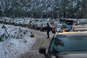 Heavy snow along US 50 caused eastbound traffic to back up for miles in Pollock Pines, Calif., Tuesday, Dec. 28, 2021. Some motorists were able to exit their cars occasionally to stretch their legs.