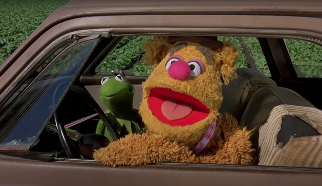 Kermit the Frog and Fozzie Bear roll down the road in a 1951 Studebaker Commander in the 1979 film "The Muppet Movie."