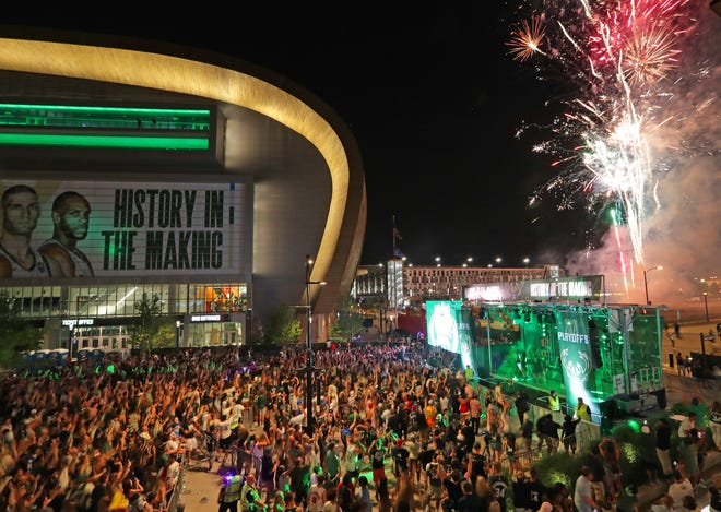 Post-game fireworks create a celebratory atmosphere as fans gather in the Deer District outside Fiserv Forum after the Milwaukee Bucks' 118-107 series-clinching victory over the Atlanta Hawks in Game 6 of the Eastern Conference finals on July 3. The win sent the Bucks to their first NBA Finals since 1974.