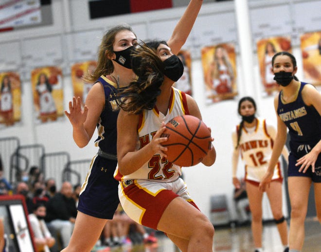 Centennial's Janessa Navarrete goes in for a layup as the Hawks took on the Burges Mustangs from El Paso in the championship game of the LCPS Holiday Hoopla Tournament.