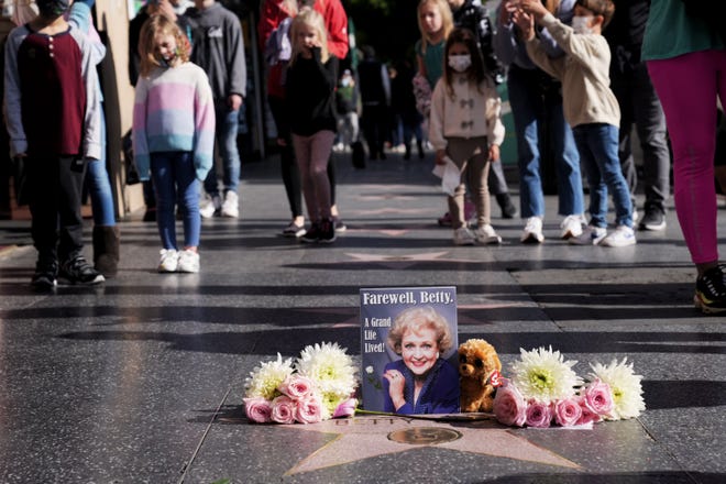 A memorial to Betty White appears at her star on the Hollywood Walk of Fame following news of her death at age 99 on Dec. 31, 2021.
