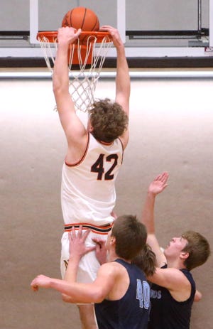 Mason Bille, 42, of Hoover dunks during their game against Louisville at Hoover on Thursday, Dec. 30, 2021. Visible for Louisville is AJ Lingenhoel, 40. 