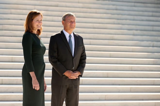 Associate Justice Amy Coney Barrett and Chief Justice John Roberts on Oct. 1, 2021.