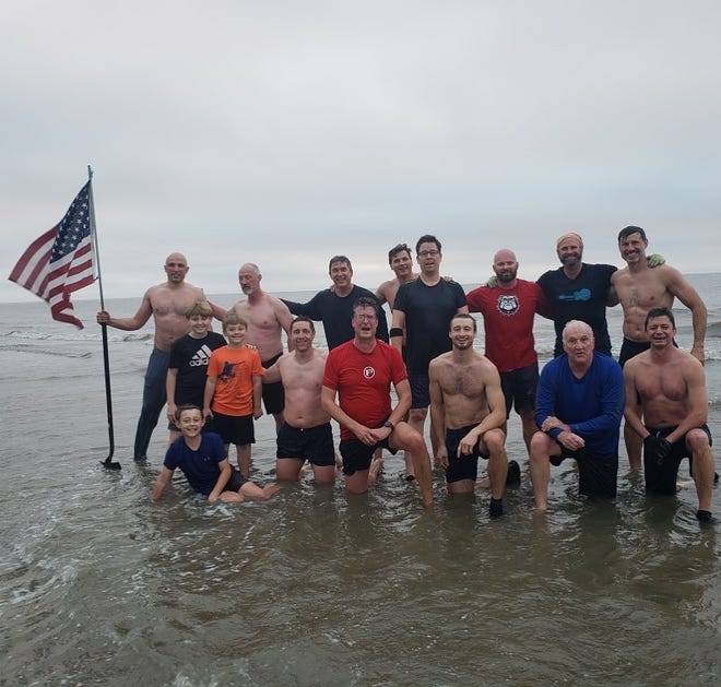 Tallahassee's Tim Center, front row, fourth from the left, enjoyed Saturday morning's workout that featured a dive into the chilly Atlantic Ocean off St. Simons Island, Georgia.