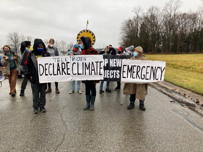 Dozens of people gather at 909 Centre Road, Greenville, on Saturday, Jan. 1, 2022, for the last day of the weeklong Occupy Biden event, where attendees camped out near President Joe Biden's home demanding action on climate change.