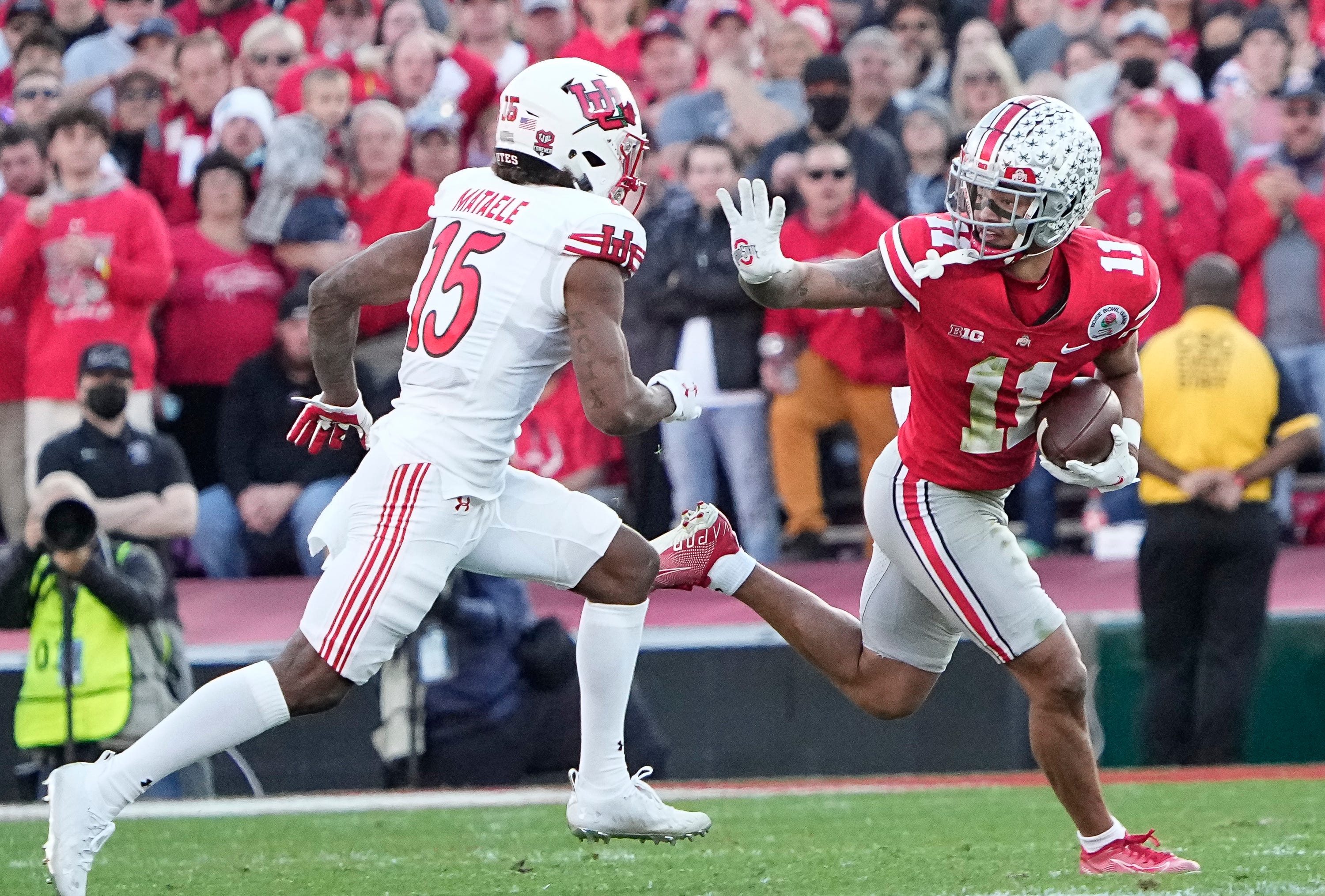 Ohio State Buckeyes wide receiver Jaxon Smith-Njigba (11) runs past Utah Utes cornerback Malone Mataele (15) during the second quarter of the Rose Bowl in Pasadena, Calif. on Jan. 1, 2022.