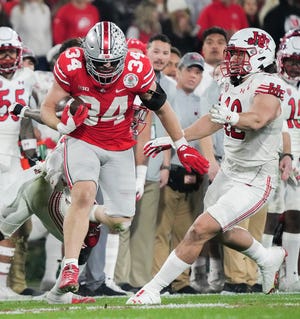 Sat., Jan. 1, 2022; Pasadena, California, USA; Ohio State Buckeyes tight end Mitch Rossi (34) runs the ball during the fourth quarter of the 108th Rose Bowl Game between the Ohio State Buckeyes and the Utah Utes at the Rose Bowl. 