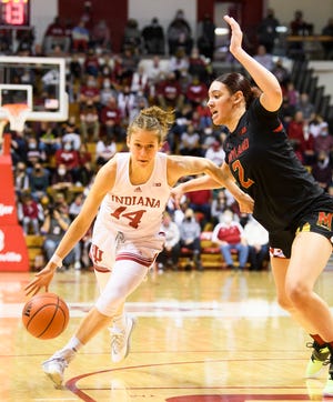 Indiana's Ali Patberg (14) drives against Maryland's Mimi Collins (2) during the first half of the Indiana versus Maryland women's basketball game at Simon Skjodt Assembly Hall on Sunday, Jan. 2, 2022.