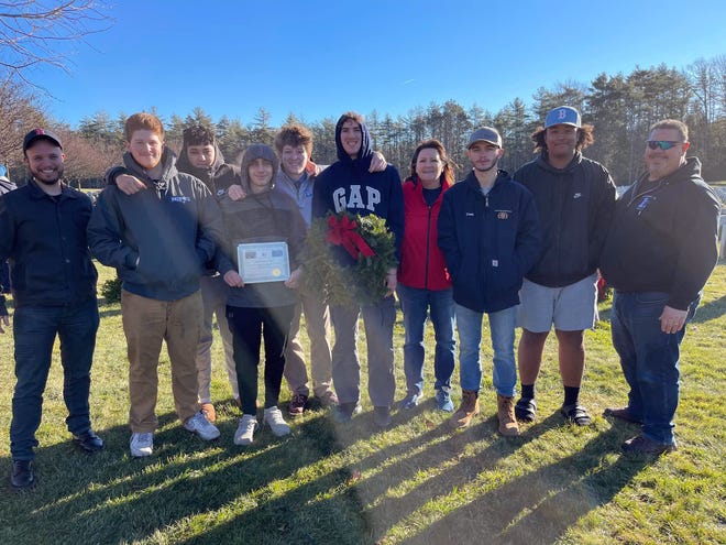 Senior HVAC students from Leominster High School's vocational-technical division are seen on Wreaths Across America Day, Dec. 17, at the Massachusetts Veterans Memorial Cemetery in Winchendon.