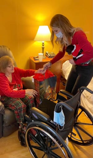 Volunteer, Tammy Nichols, delivered presents to residents of Fountainview of Monroe on Christmas Day.