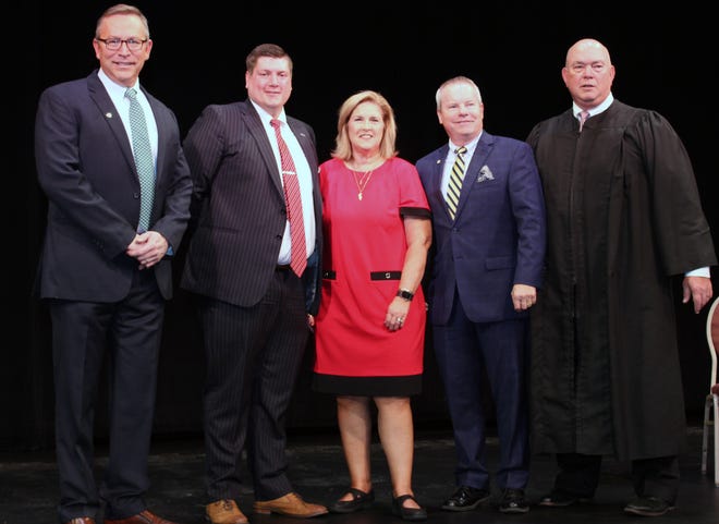 Fairfield Council members-elect, from left, Tim Meyers, Matt Davidson, and Gwen Brill, along with Mayor-elect Mitch Rhodus were sworn into office by Butler County Common Pleas Judge Keith Spaeth.