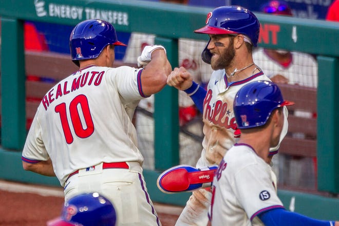 The Phillies' J.T. Realmuto, 10, and Bryce Harper celebrate Realmuto's three-run homer against the Mets in May.