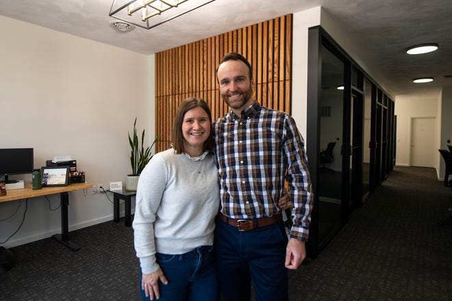 Jamie and Brian Getz, co-owners of the Hub & Spoke coworking space, stand in the front office area of their Morton business on Dec. 31, 2021.