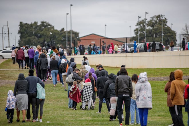 Hundreds of people wait in line to be tested for COVID-19 at the Florida A&M University testing site Monday, Jan. 3, 2022. As of Thursday morning, there were 148 people with COVID-19 hospitalized in the capital city and county.