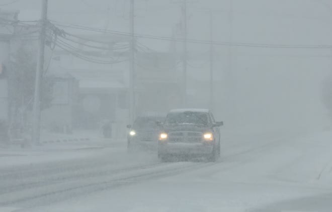 Heavy snow caused low visibility on Coastal Highway Monday morning.